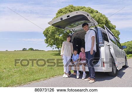 Stock Photograph - Japanese family in a city park. Fotosearch