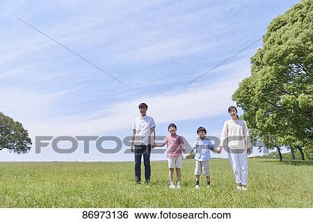 Stock Photograph - Japanese family in a city park. Fotosearch