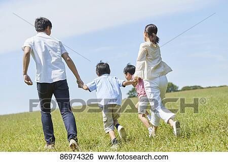 Japanese family in a city park View Large Photo Image Stock Photograph - Japanese family in a city park. Fotosearch