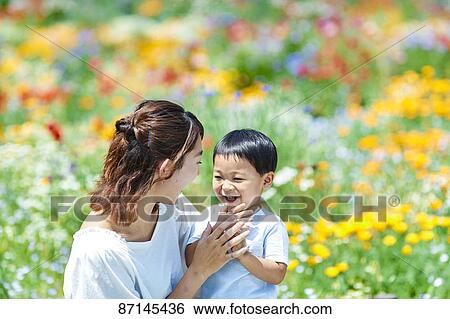 Japanese family in a city park View Large Photo Image Stock Photograph - Japanese family in a city park. Fotosearch