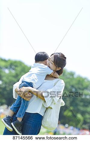 Japanese family in a city park View Large Photo Image Stock Photograph - Japanese family in a city park. Fotosearch