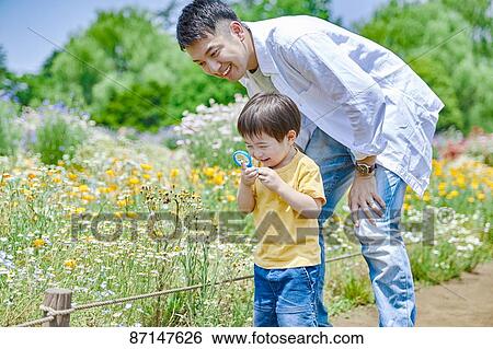 Stock Photograph - Japanese family in a city park. Fotosearch