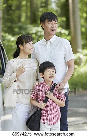 Stock Photography - Japanese family in a city park. Fotosearch