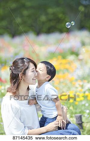 Stock Photography - Japanese family in a city park. Fotosearch