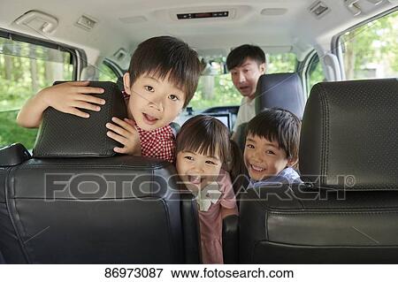 Japanese family in the car View Large Photo Image Stock Photo - Japanese family in the car. Fotosearch