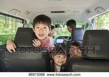 Japanese family in the car View Large Photo Image Stock Photo - Japanese family in the car. Fotosearch