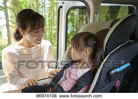 Stock Photo - Japanese family in the car. Fotosearch