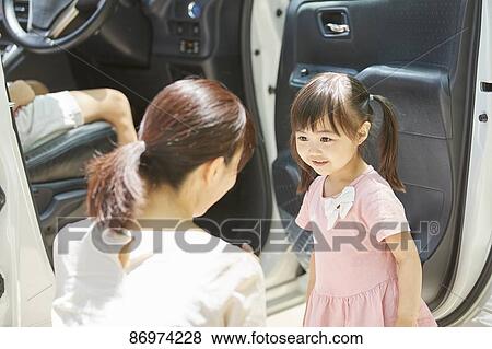 Japanese family in the car View Large Photo Image Stock Photo - Japanese family in the car. Fotosearch