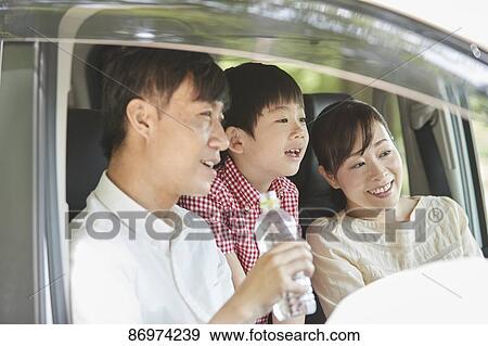Japanese family in the car View Large Photo Image Stock Photo - Japanese family in the car. Fotosearch