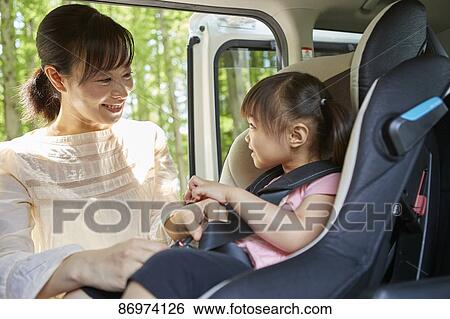 Japanese family in the car View Large Photo Image Stock Photograph - Japanese family in the car. Fotosearch