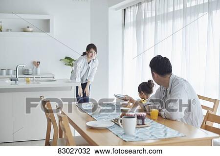 Stock Image - Japanese family in the kitchen. Fotosearch