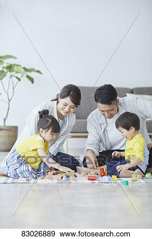 Stock Photo - Japanese family in the living room. Fotosearch