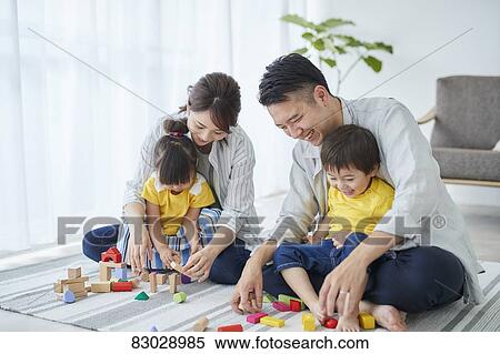 Stock Photography - Japanese family in the living room. Fotosearch