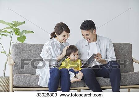 Japanese family on the sofa View Large Photo Image Stock Photo - Japanese family on the sofa. Fotosearch