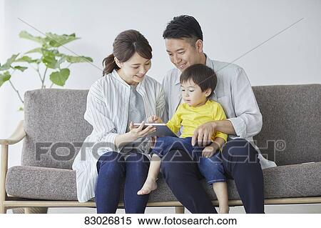 Japanese family on the sofa View Large Photo Image Stock Photography - Japanese family on the sofa. Fotosearch