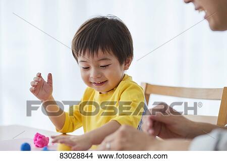 Picture - Japanese father and kid playing. Fotosearch