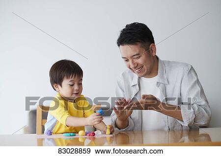 Japanese father and kid playing View Large Photo Image Stock Photo - Japanese father and kid playing. Fotosearch