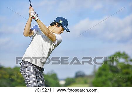 Japanese golf player on course View Large Photo Image Stock Image - Japanese golf player on course. Fotosearch