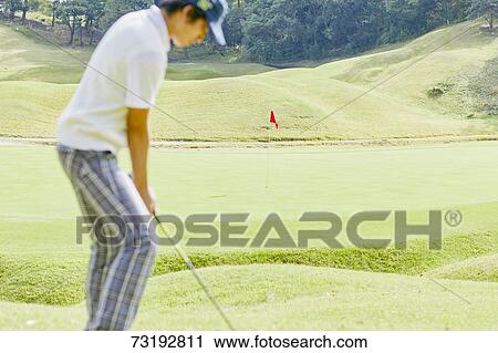 Japanese golf player on course View Large Photo Image Stock Image - Japanese golf player on course. Fotosearch