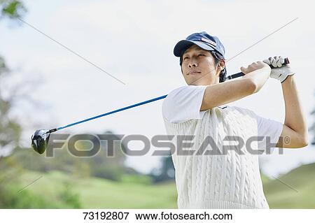 Japanese golf player on course View Large Photo Image Stock Photo - Japanese golf player on course. Fotosearch