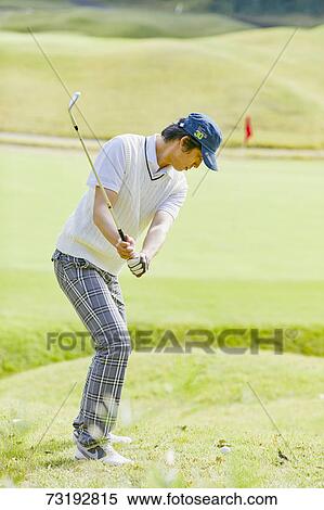 Stock Photography - Japanese golf player on course. Fotosearch