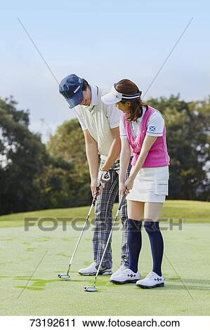 Japanese golf players on course View Large Photo Image Stock Image - Japanese golf players on course. Fotosearch