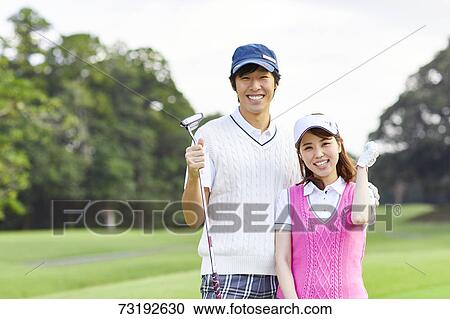Japanese golf players on course View Large Photo Image Stock Image - Japanese golf players on course. Fotosearch