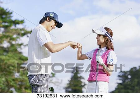 Japanese golf players on course View Large Photo Image Stock Image - Japanese golf players on course. Fotosearch