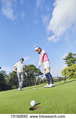 Japanese golf players on course View Large Photo Image Stock Image - Japanese golf players on course. Fotosearch