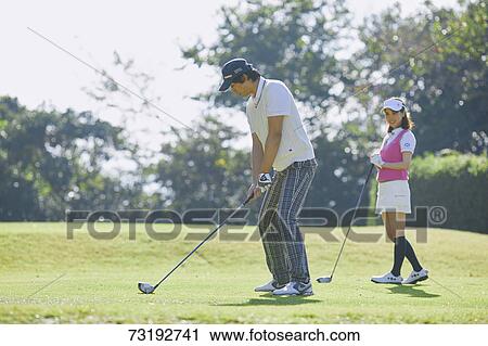 Japanese golf players on course View Large Photo Image Stock Image - Japanese golf players on course. Fotosearch