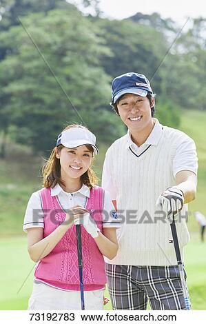 Japanese golf players on course View Large Photo Image Stock Image - Japanese golf players on course. Fotosearch