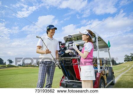 Japanese golf players on course View Large Photo Image Stock Image - Japanese golf players on course. Fotosearch