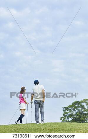 Japanese golf players on course View Large Photo Image Stock Image - Japanese golf players on course. Fotosearch
