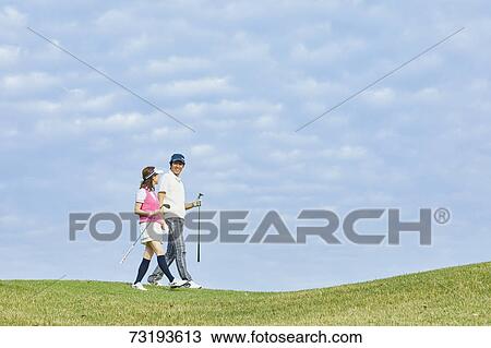 Japanese golf players on course View Large Photo Image Stock Image - Japanese golf players on course. Fotosearch