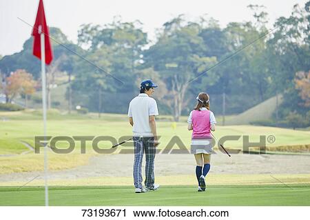 Japanese golf players on course View Large Photo Image Stock Image - Japanese golf players on course. Fotosearch
