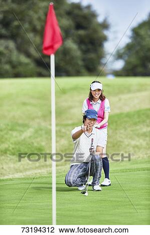 Japanese golf players on course View Large Photo Image Stock Image - Japanese golf players on course. Fotosearch
