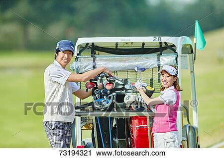 Japanese golf players on course View Large Photo Image Stock Image - Japanese golf players on course. Fotosearch