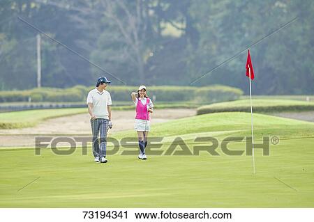 Japanese golf players on course View Large Photo Image Stock Image - Japanese golf players on course. Fotosearch