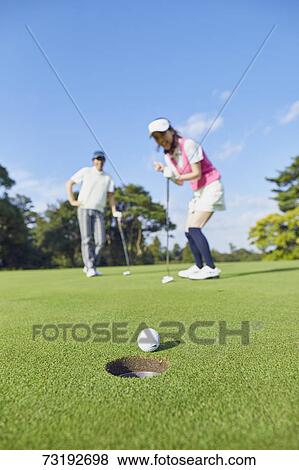 Japanese golf players on course View Large Photo Image Stock Photo - Japanese golf players on course. Fotosearch