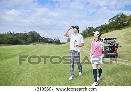 Japanese golf players on course View Large Photo Image Stock Photo - Japanese golf players on course. Fotosearch