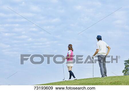 Japanese golf players on course View Large Photo Image Stock Photo - Japanese golf players on course. Fotosearch