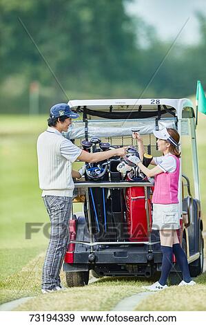 Japanese golf players on course View Large Photo Image Stock Photo - Japanese golf players on course. Fotosearch