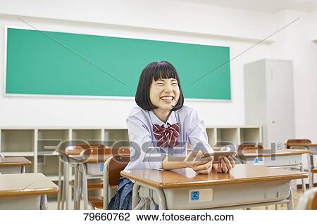 Stock Image - Japanese high-school girl. Fotosearch