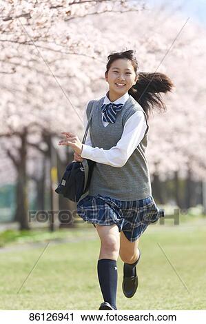 Stock Image - Japanese junior-high schoolgirl in uniform. Fotosearch