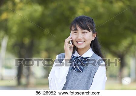 Stock Image - Japanese junior-high schoolgirl in uniform. Fotosearch