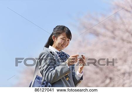 Japanese junior-high schoolgirl in uniform View Large Photo Image Stock Image - Japanese junior-high schoolgirl in uniform. Fotosearch