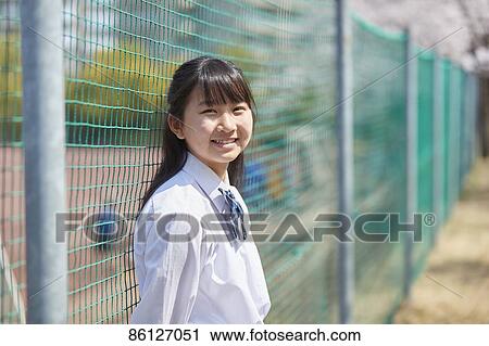 Stock Image - Japanese junior-high schoolgirl in uniform. Fotosearch