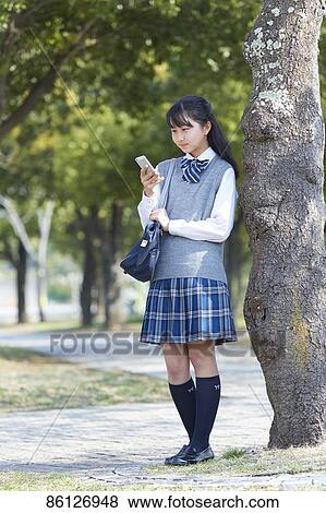 Japanese junior-high schoolgirl in uniform View Large Photo Image Stock Photo - Japanese junior-high schoolgirl in uniform. Fotosearch
