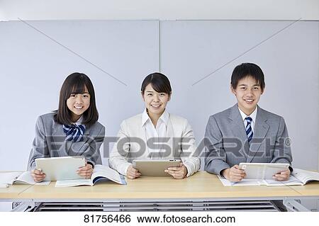 Stock Photograph - Japanese junior high students with teacher. Fotosearch