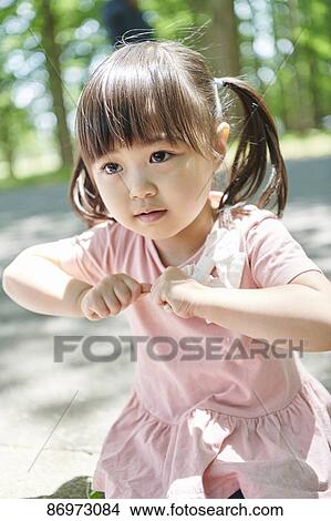 Japanese kid in a city park View Large Photo Image Picture - Japanese kid in a city park. Fotosearch
